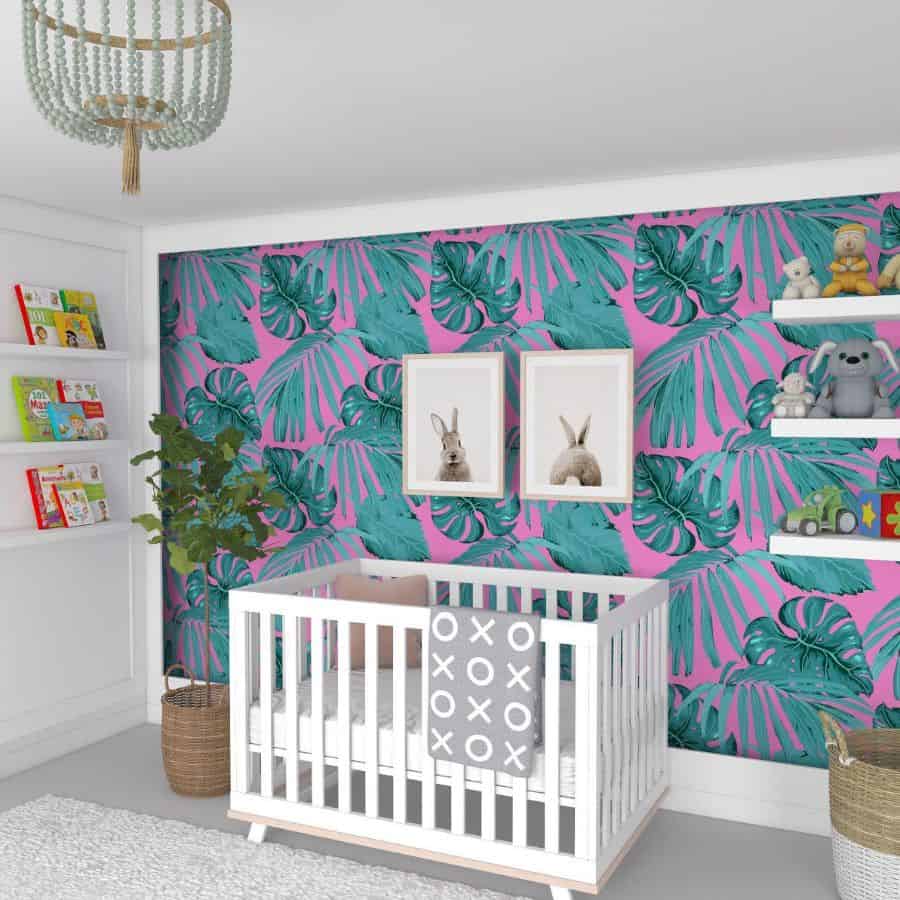 colorful nursery fern green and pink wallpaper white crib wall shelves wicker baskets
