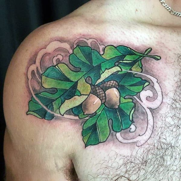 Oak Leaf Tattoos For Guys On Upper Chest In Green Ink