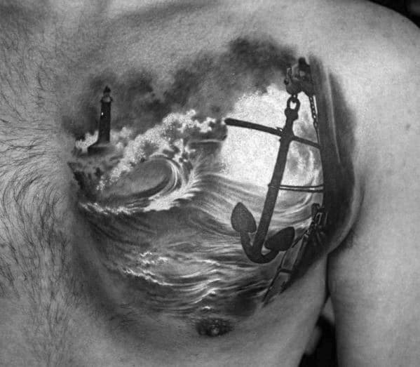 Black and white tattoo of a lighthouse, crashing waves, and anchor on a man's chest