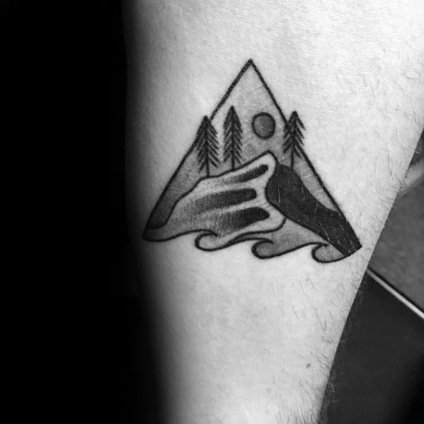 Minimalist black ink tattoo of a mountain landscape with pine trees, a rising sun, and flowing waves, symbolizing adventure and a love for nature.