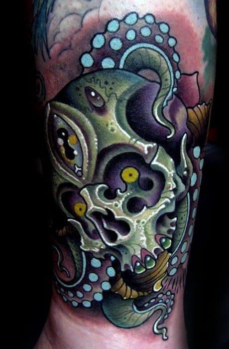 Vibrant octopus wrapping around a skull with detailed eyes, using bright greens, yellows, and purples to create a striking and colorful design.