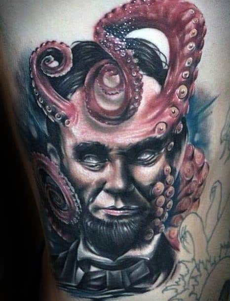 Tattoo of a bearded man like Abraham Lincoln with octopus tentacles around his head