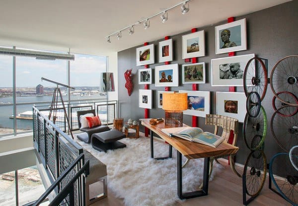 Vibrant loft office featuring a gallery wall, cozy seating, and expansive city views.
