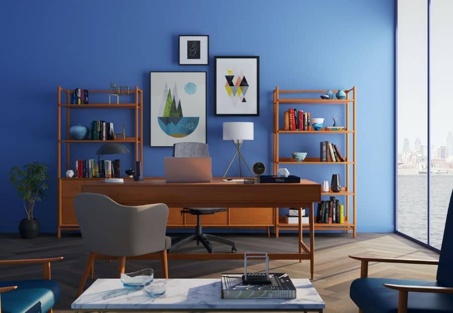 vintage office with wood furniture and blue accent wall