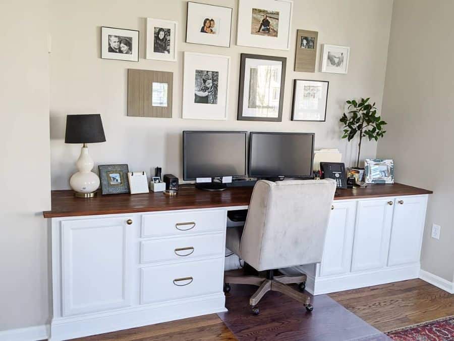 family photos hanging in home office 