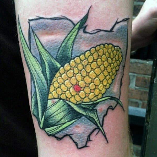 Colorful tattoo of a corn cob with green husks, set against an outline of Ohio with bold shading and vibrant details.