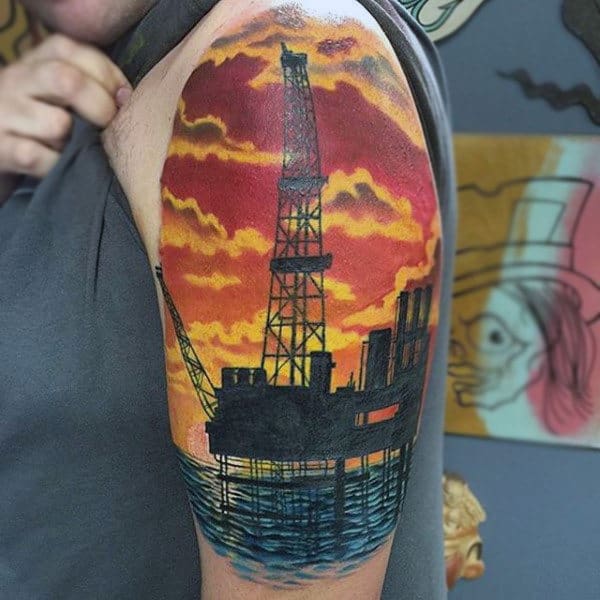Oil Rig At Sunset Upper Arm Sleeve Tattoo On Man