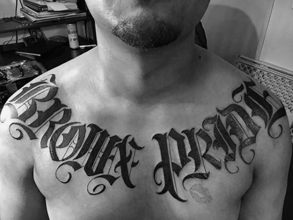 Old English Male Upper Chest Black Ink Tattoo Word Designs