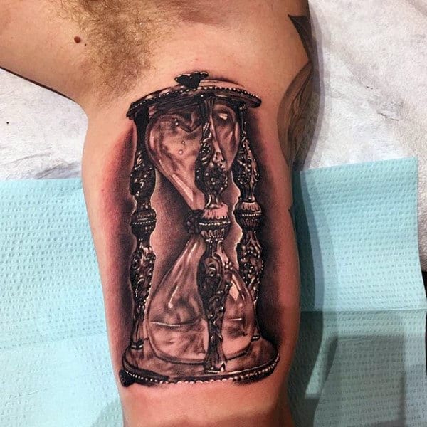 Old Sandglass Hourglass Tattoo On Mans Bicep