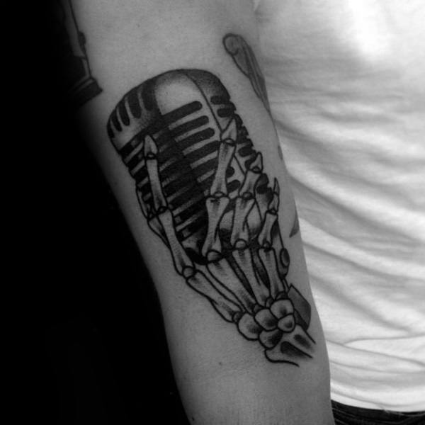 Old School Guys Skeleton Hand With Microhpone Tattoo Design Ideas On Arm