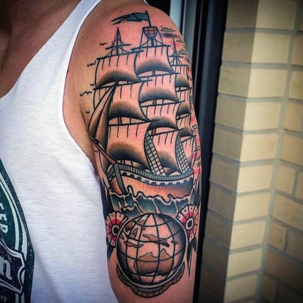 Old School Male Globe Arm Tattoo With Sailing Ship Design