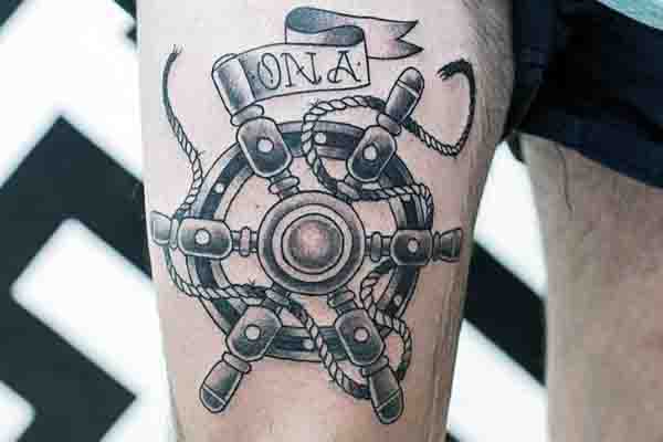 Old School Ship Wheel Tattoo On Mans Thigh