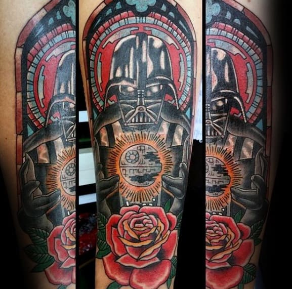 Vibrant tattoo of Darth Vader holding the Death Star, framed with stained glass and roses in bold colors