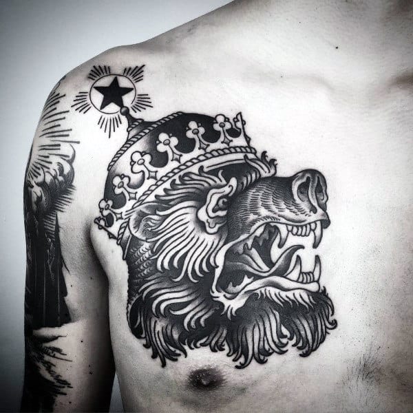 Tattoo of roaring bear wearing a crown, with a star above, on a chest and shoulder