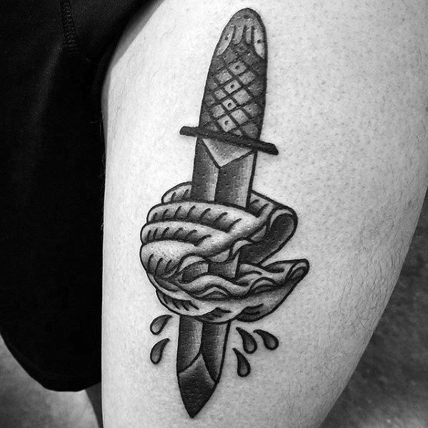 Bold blackwork tattoo of a dagger piercing through a clam shell, with drops around it symbolizing motion or impact, in a traditional style.