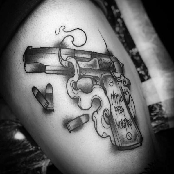 Black and gray tattoo of a smoking 1911 pistol with bullets and stylized smoke, featuring the phrase "Memento Mori" on the grip for a bold design.