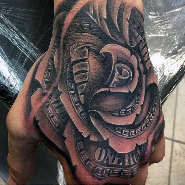 Tattoo of a detailed rose and clock design on a hand