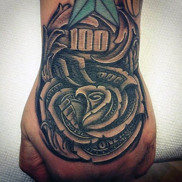Tattoo on a hand featuring a rose made of dollar bills and the number 100
