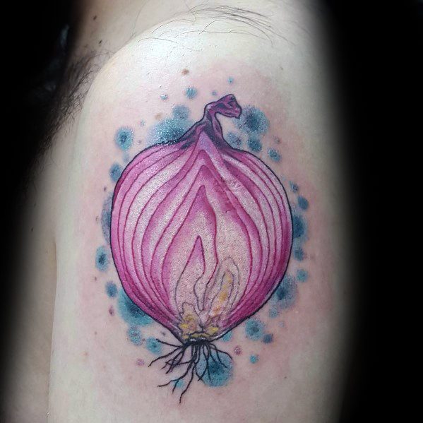 Vibrant tattoo of a sliced red onion on the upper arm, featuring fine details, bold outlines, and a blue watercolor-style background for contrast.