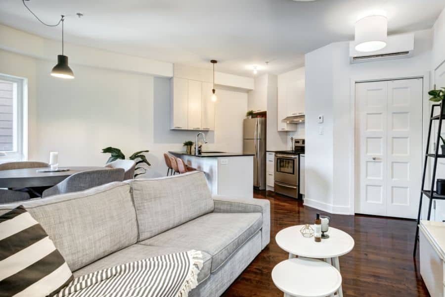 open plan living room and kitchen with gray sofa