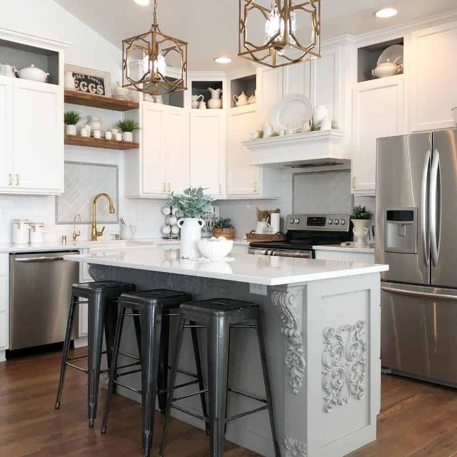 elegant kitchen white cabinets gray island white marble countertop three black metal stools