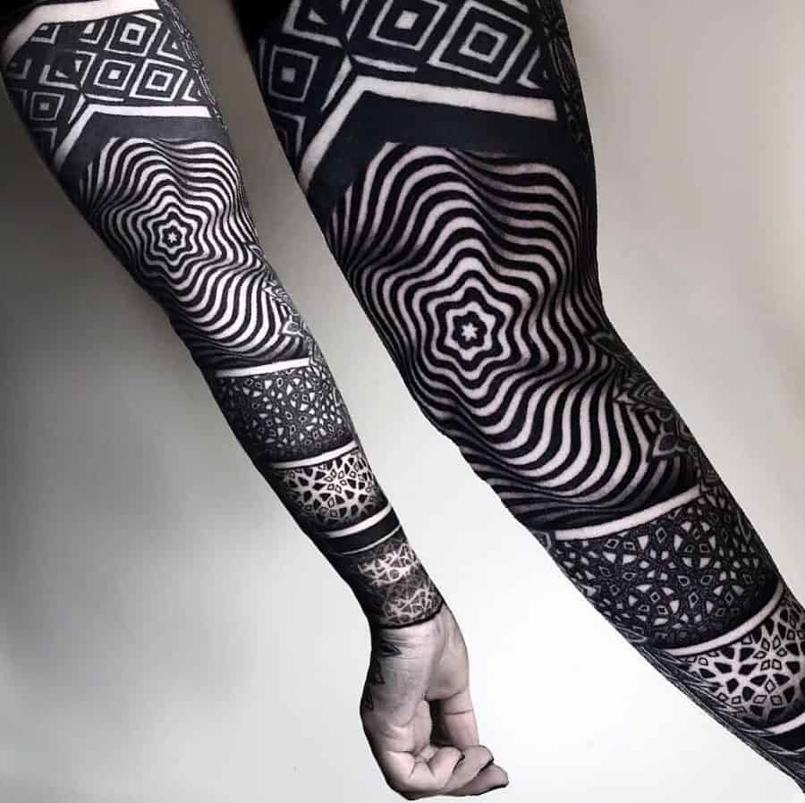 Full sleeve tattoo with bold black geometric and optical illusion patterns, creating a hypnotic and intricate modern design.