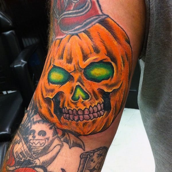 Orange Pumpkin With Glowing Green Eyes Mens Arm Tattoo