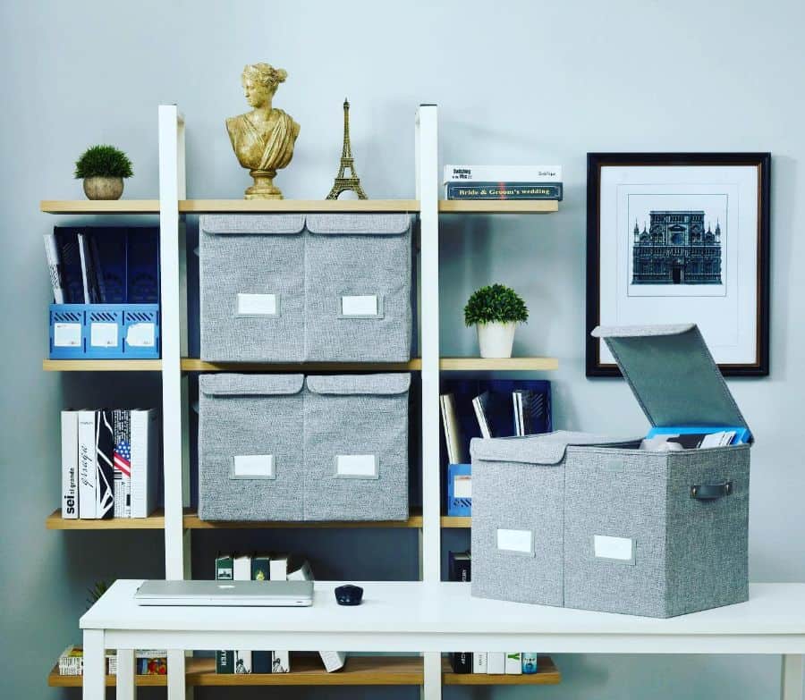 metal and wood office storage unit gray storage baskets small pot plants framed wall art