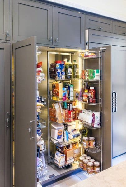 Pull-out pantry shelves in a sleek kitchen cabinet with organized food storage.