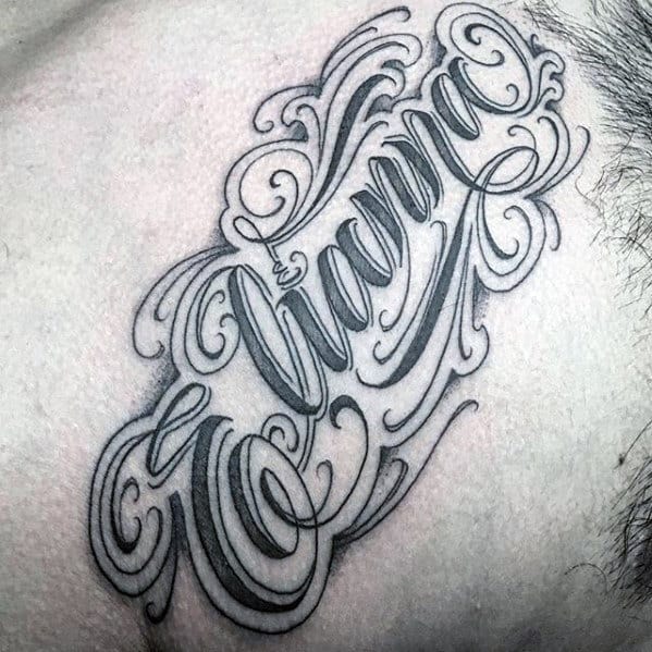 ornate script kids name male chest tattoo