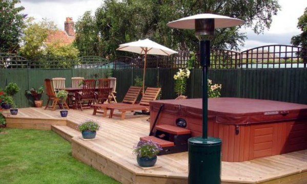 wood deck hot tub sun lounges wood table and chairs set