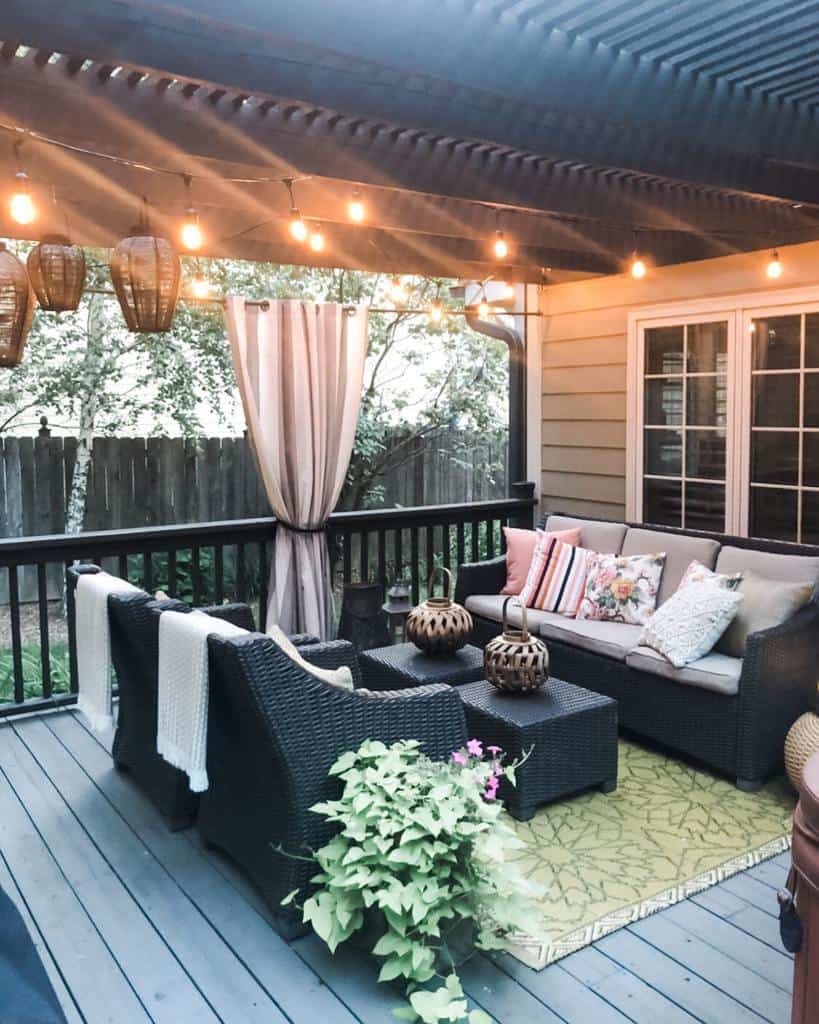 large outdoor wood patio deck with wicker furniture