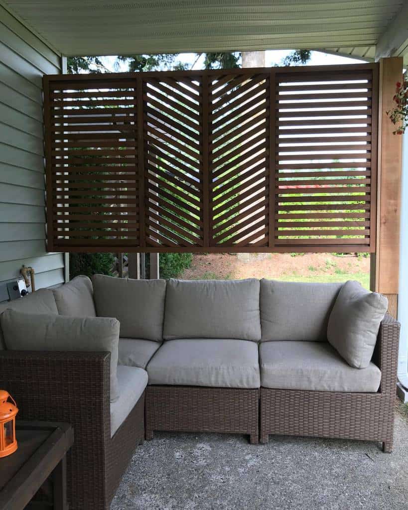 small enclosed patio with wicker sofa 