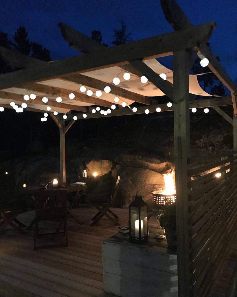 outdoor wood deck patio pergola with string lights