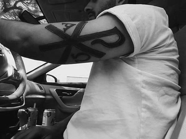 Outer Arm Chi Rho Black Ink Masculine Tattoo Ideas For Guys