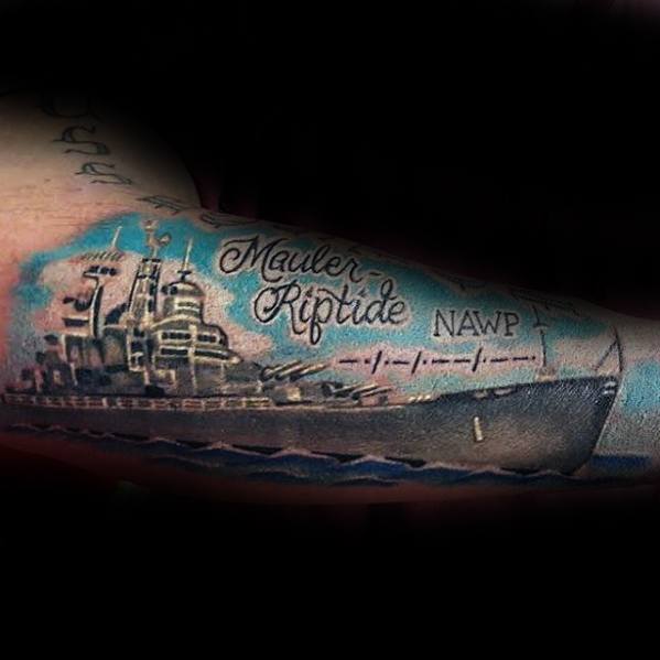 Realistic battleship tattoo with "Mauler Riptide" and "NAWP" text on arm