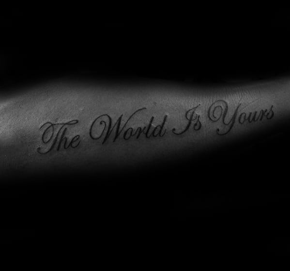 Outer Forearm Cursive Quote The World Is Yours Tattoo On Gentleman