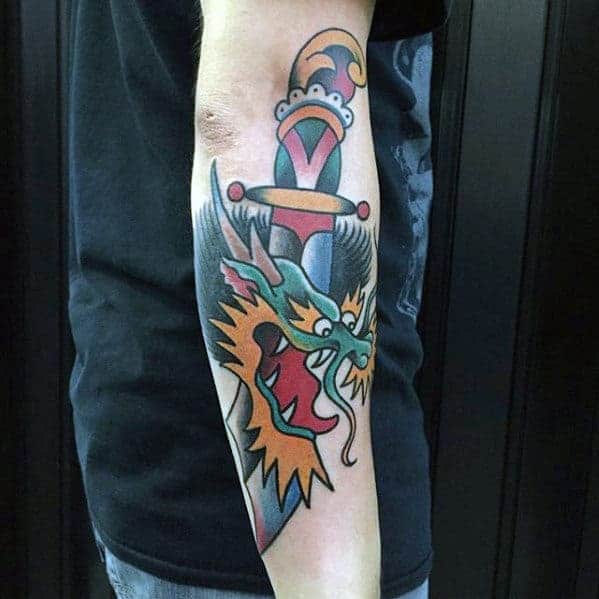 Colorful dragon and dagger tattoo on a forearm