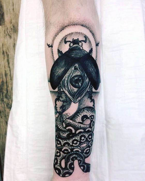 outer forearm guys scarab bettle with snake tattoo