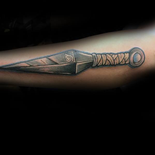 Kunai tattoo design with intricate details and shading, symbolizing the iconic ninja weapon from Naruto