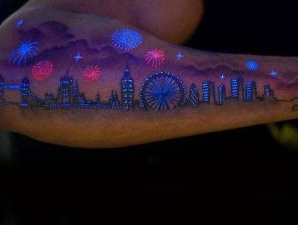 Outer Forearm Mens Glow In The Dark Tattoo Of Skyline With Fireworks Design