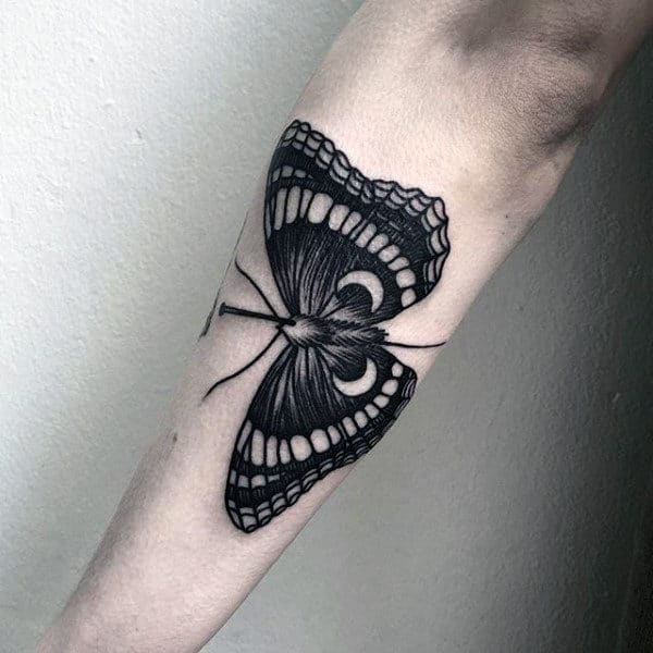 Outer Forearm Moth With Negative Space Moons Tattoo