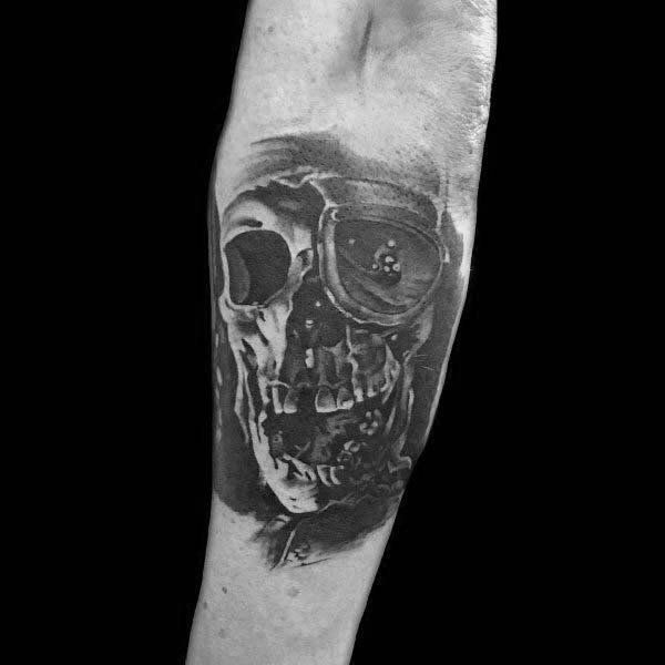 Black and gray realistic tattoo of One-Eyed Willy from The Goonies, featuring a detailed skull with an eye patch and deep shading.