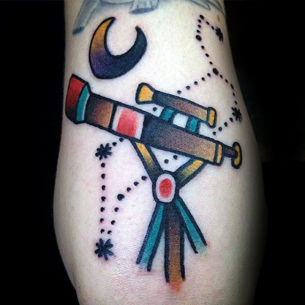 Colorful telescope tattoo with stars, crescent moon, and constellation patterns