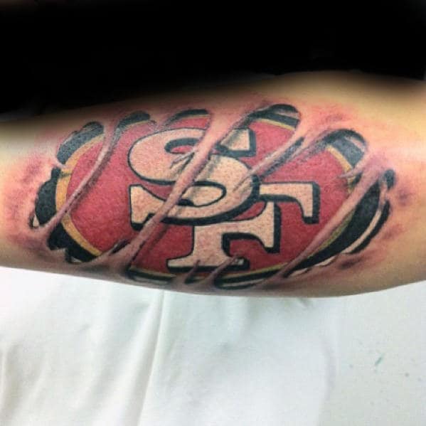 Outer Forearm Tattoo With Ripped Skin Design San Francisco 49ers Theme For Men