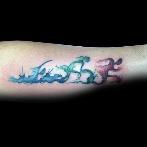 Abstract watercolor tattoo depicting waves and fluid motion in shades of blue, green, and red, flowing across the forearm.