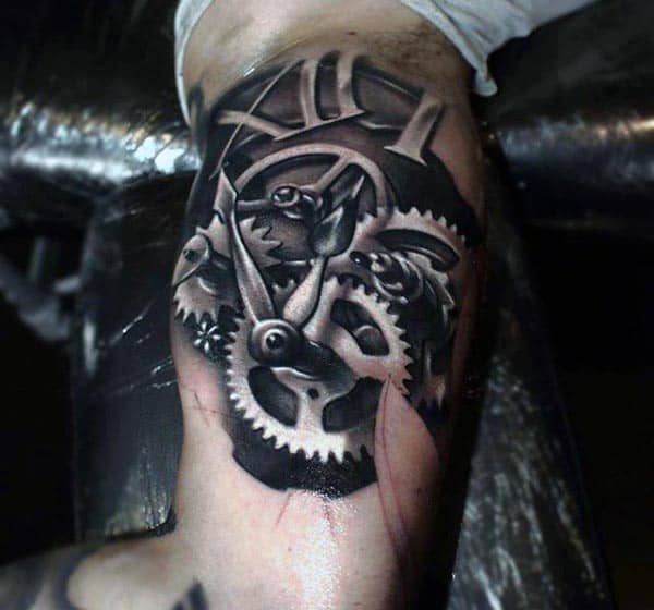 Black and grey biomechanical tattoo of exposed clock gears and Roman numerals, creating a 3D illusion of machinery beneath the skin