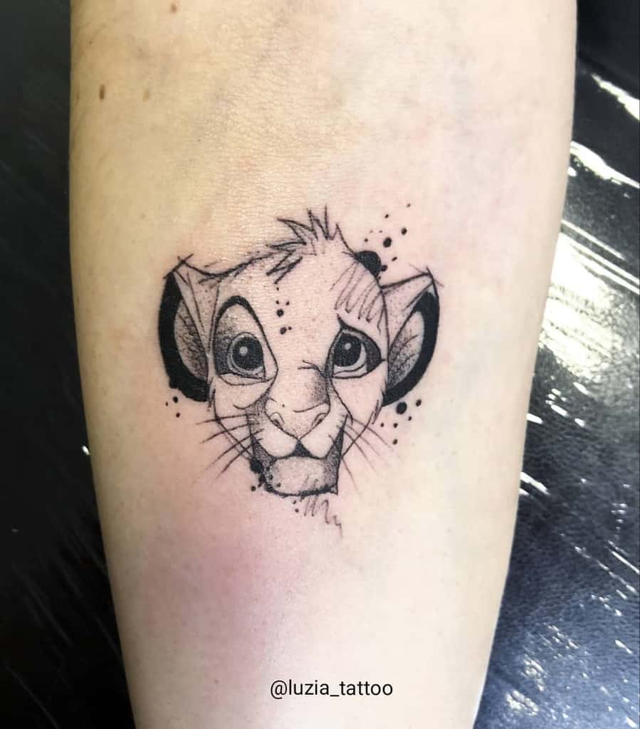Minimalist black ink tattoo of Simba as a cub with detailed shading and dots, capturing his curious and playful expression