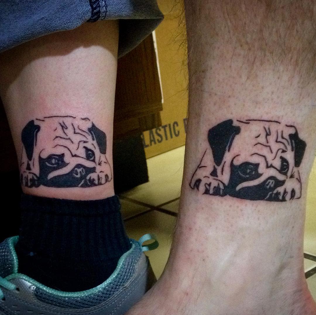 Matching tattoos of a pug lying down with its head peeking out, depicted in simple black lines