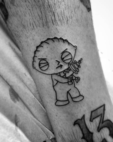 Tattoo of Stewie Griffin from Family Guy in a black ink outline style, holding his iconic ray gun with a mischievous expression.